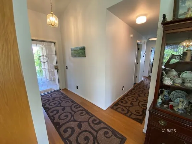 walk in closet with wooden floor