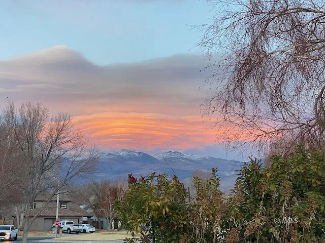 a view of a town with mountains in the background