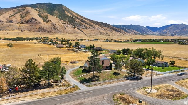 4468 North Droubay Road Tooele, UT 84074 - Photo 55 of 60 Rural property with mountain scenery, expansive open fields, and residential structures
