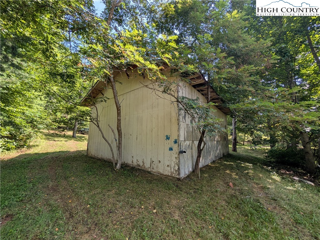 803 Flat Rock Road Crumpler, NC 28617 - Photo 38 of 50 a view of backyard with large tree