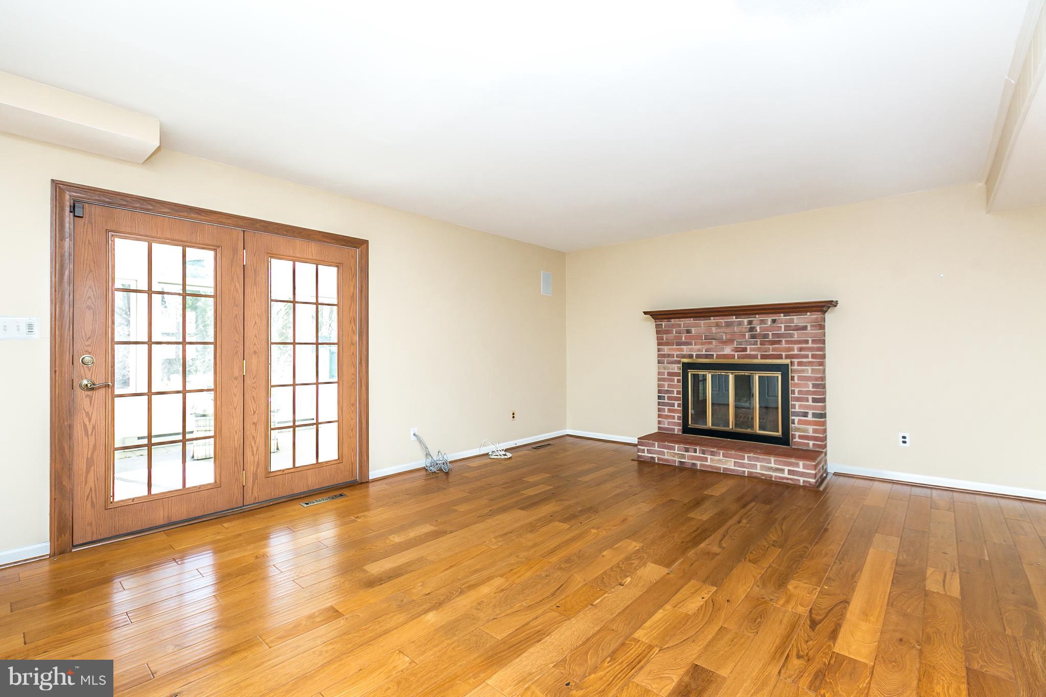 1013 Breezewick Road Baltimore, MD 21286 - Photo 14 of 40 Wood Fireplace. Beautiful Wood doors to SunRoom