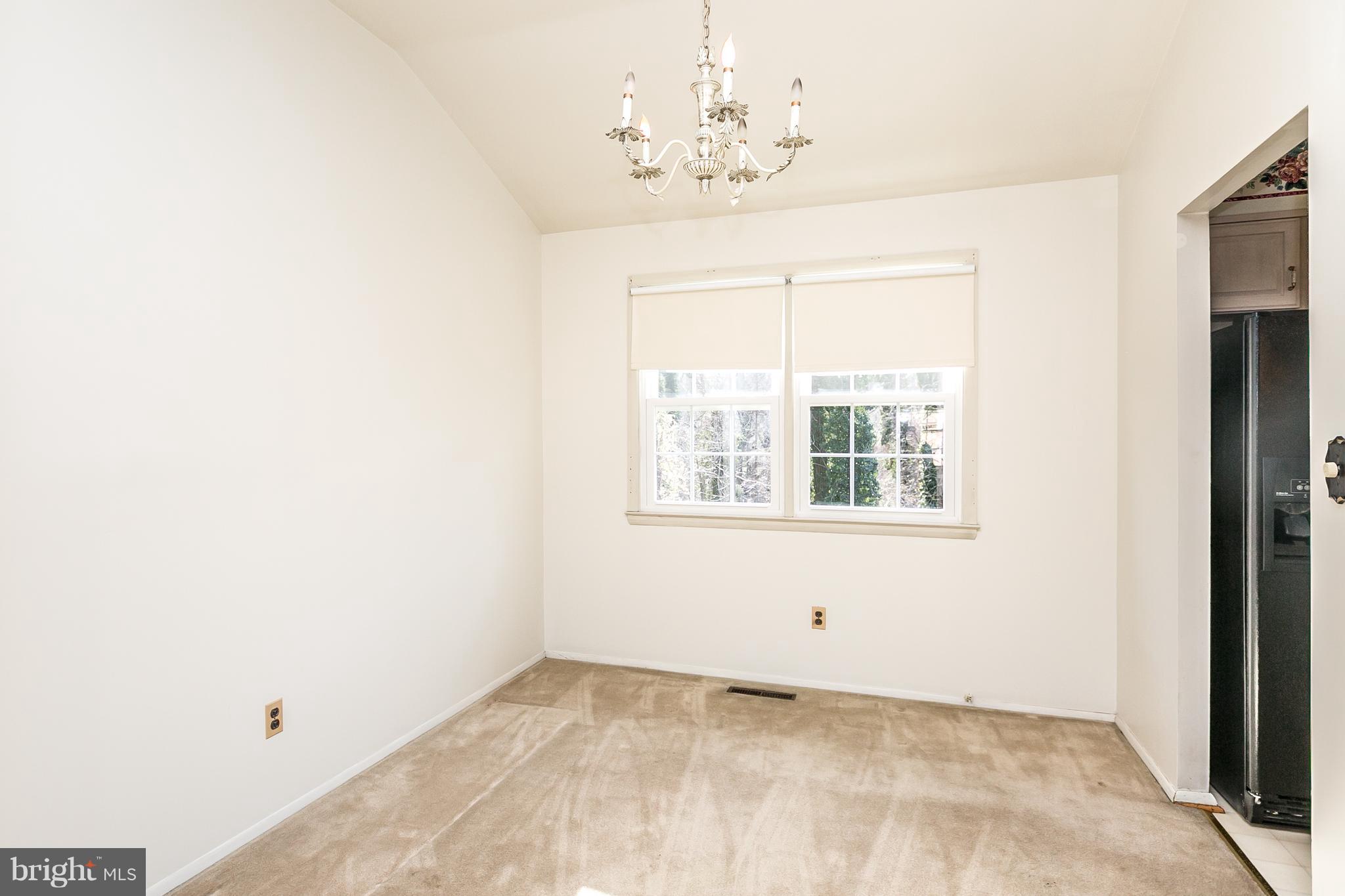 1013 Breezewick Road Baltimore, MD 21286 - Photo 8 of 40 Formal Dining Room with Chandelier