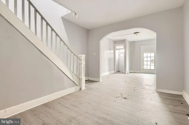 a view of an entryway with wooden floor