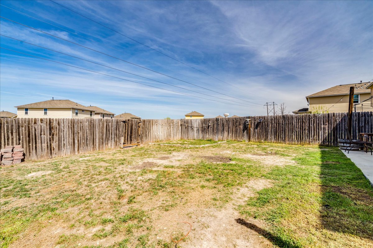 312 Triumph Road Buda, TX 78610 - Photo 35 of 36 a swimming pool with an outdoor space and seating area