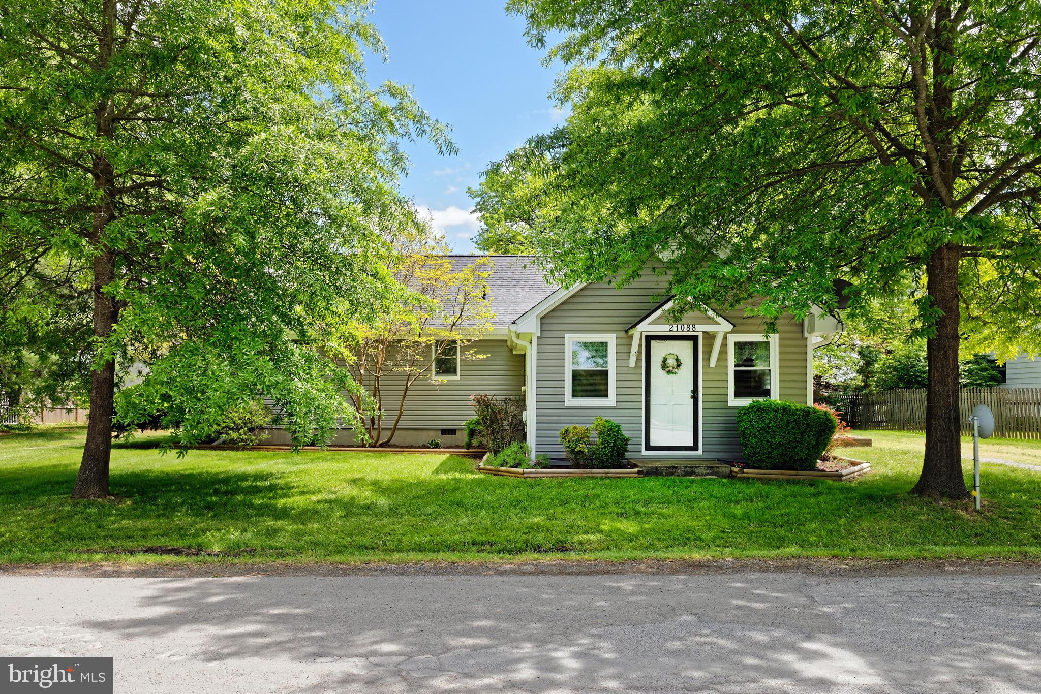 21088 Unison Road Middleburg, VA 20117 - Photo 2 of 66 a front view of a house with a garden