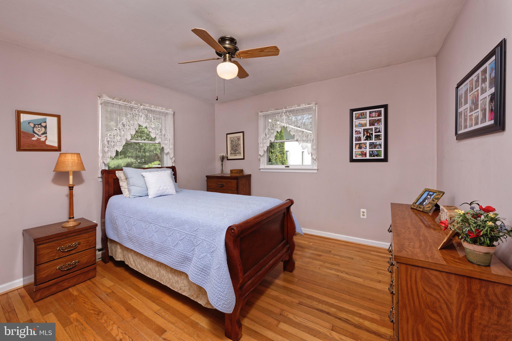 21088 Unison Road Middleburg, VA 20117 - Photo 13 of 66 a bedroom with a bed and wooden floor