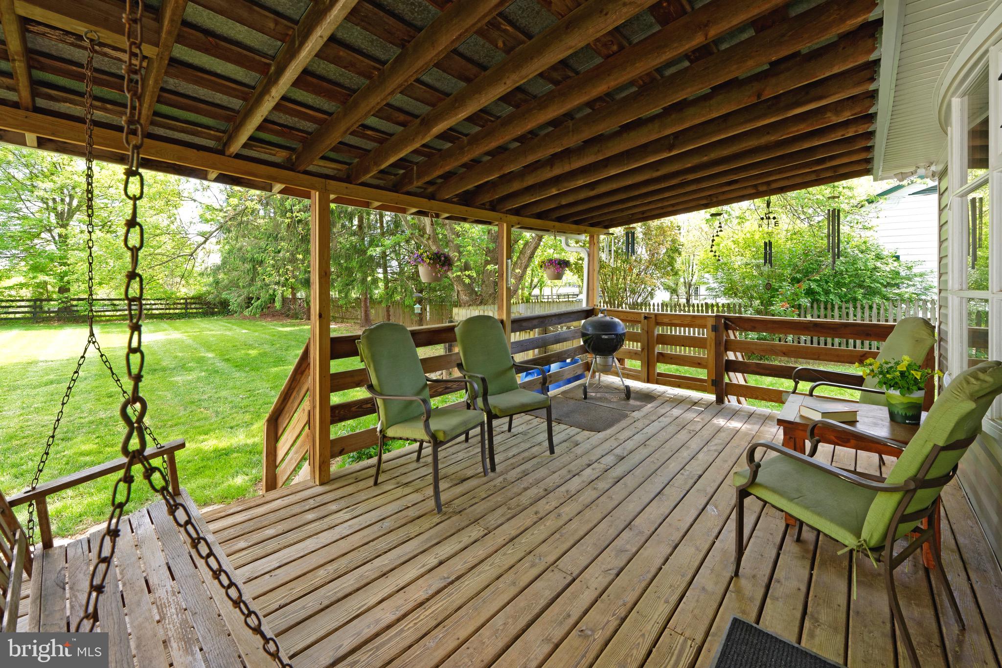 21088 Unison Road Middleburg, VA 20117 - Photo 15 of 66 a view of a chairs and table on the wooden floor