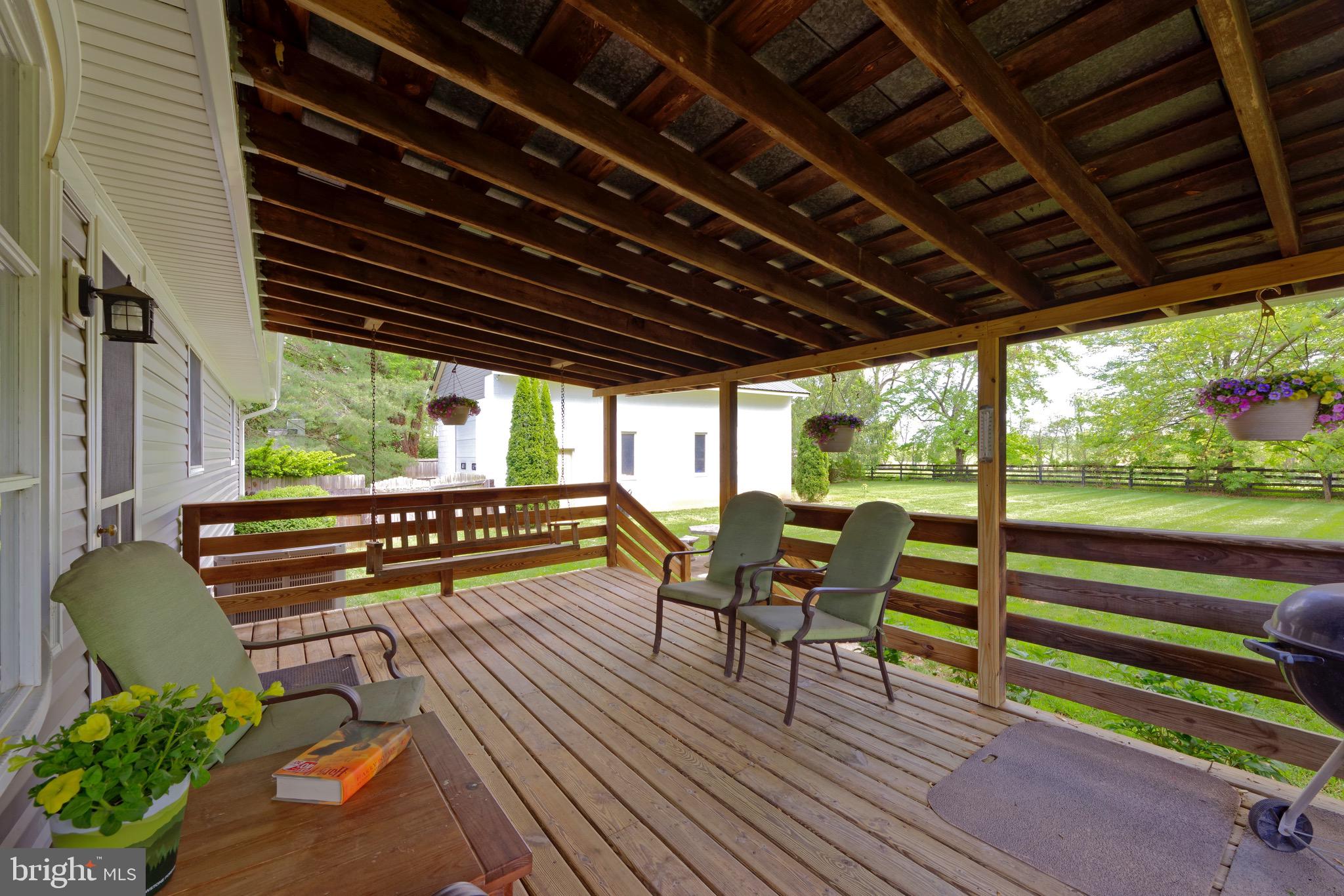 21088 Unison Road Middleburg, VA 20117 - Photo 16 of 66 a view of a chairs and table in the balcony