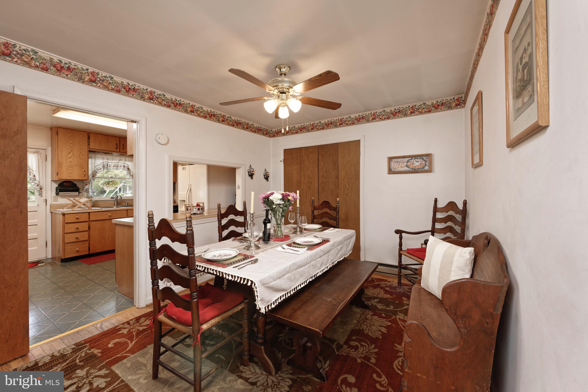 21088 Unison Road Middleburg, VA 20117 - Photo 7 of 66 a view of a dining room with furniture and a chandelier