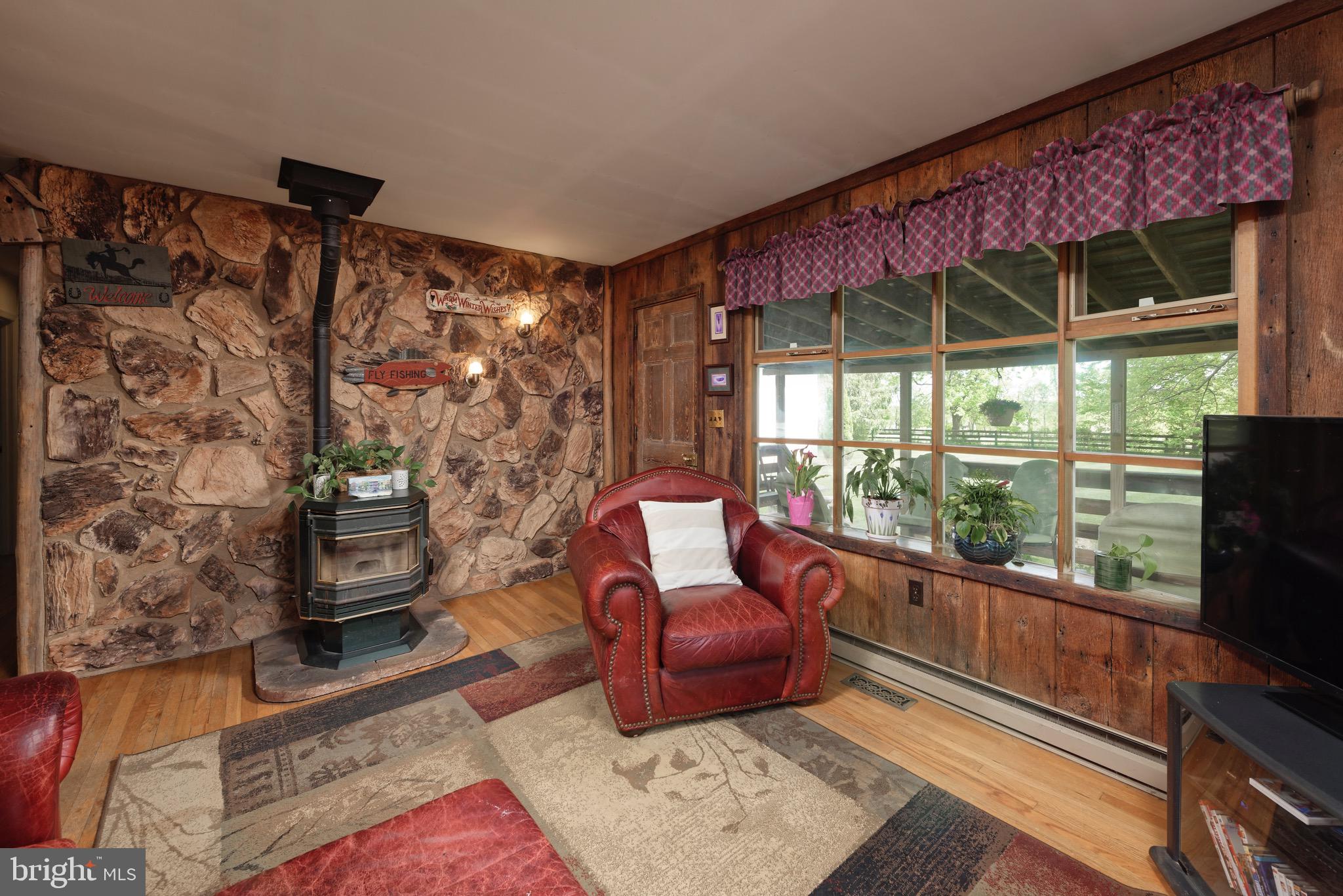21088 Unison Road Middleburg, VA 20117 - Photo 10 of 66 a living room with furniture and a floor to ceiling window