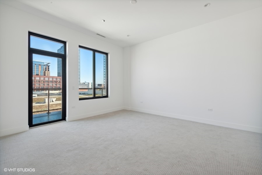 323 South Racine Avenue, Unit 6A Chicago, IL 60607 - Photo 17 of 28 an empty room with windows