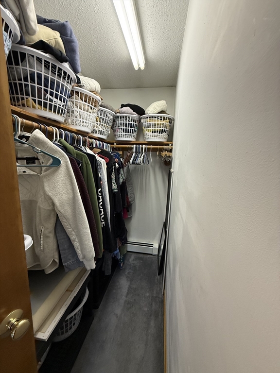222 Bridge Street Warren, MA 01083 - Photo 21 of 40 a view of walk in closet with clothes and shoes