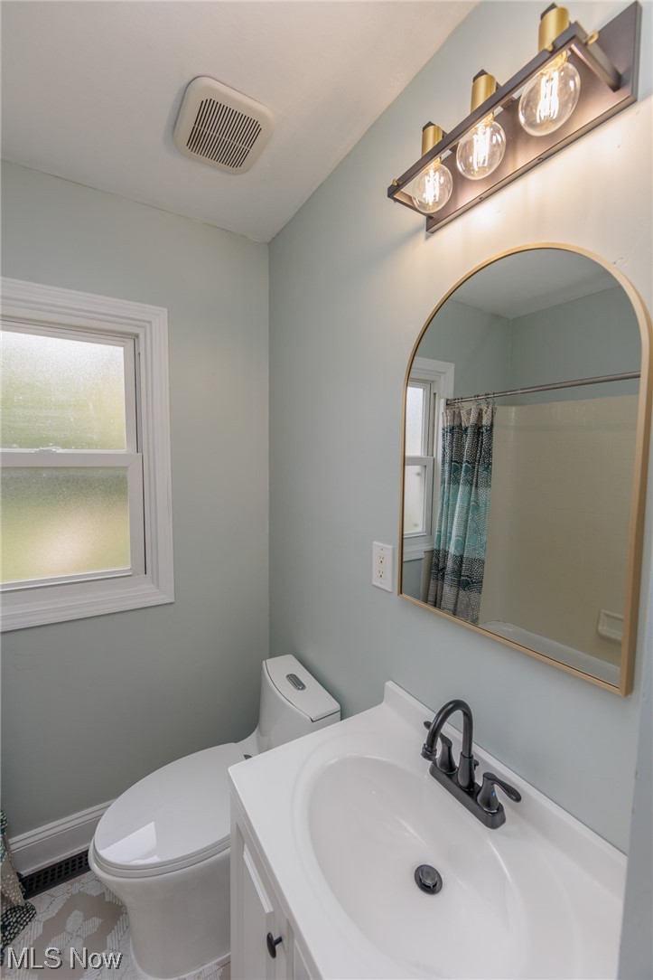 355 Dellwood Road Avon Lake, OH 44012 - Photo 22 of 35 Bathroom with plenty of natural light, tile floors, toilet, and vanity