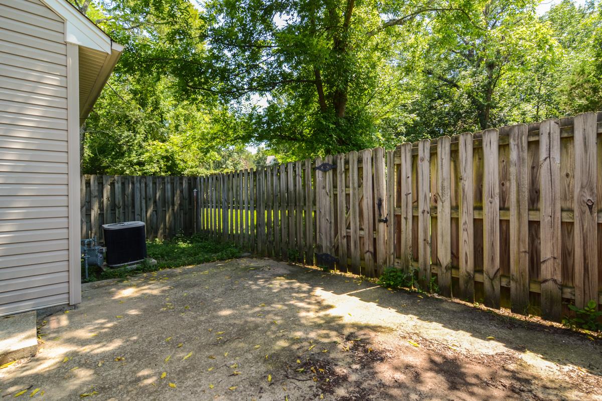 3401 Anderson Road, Unit 52 Antioch, TN 37013 - Photo 21 of 24 a view of a backyard with wooden fence and a large tree