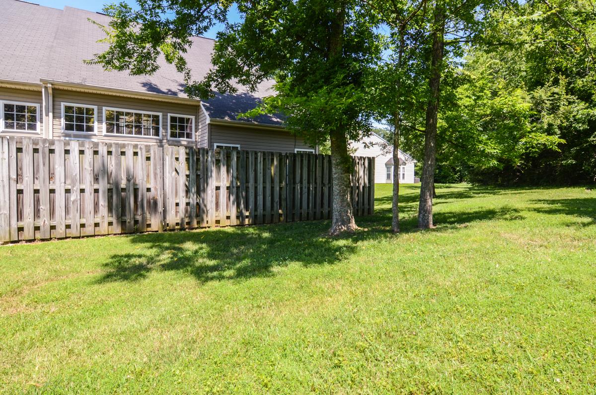 3401 Anderson Road, Unit 52 Antioch, TN 37013 - Photo 24 of 24 a view of a backyard with wooden fence and large trees
