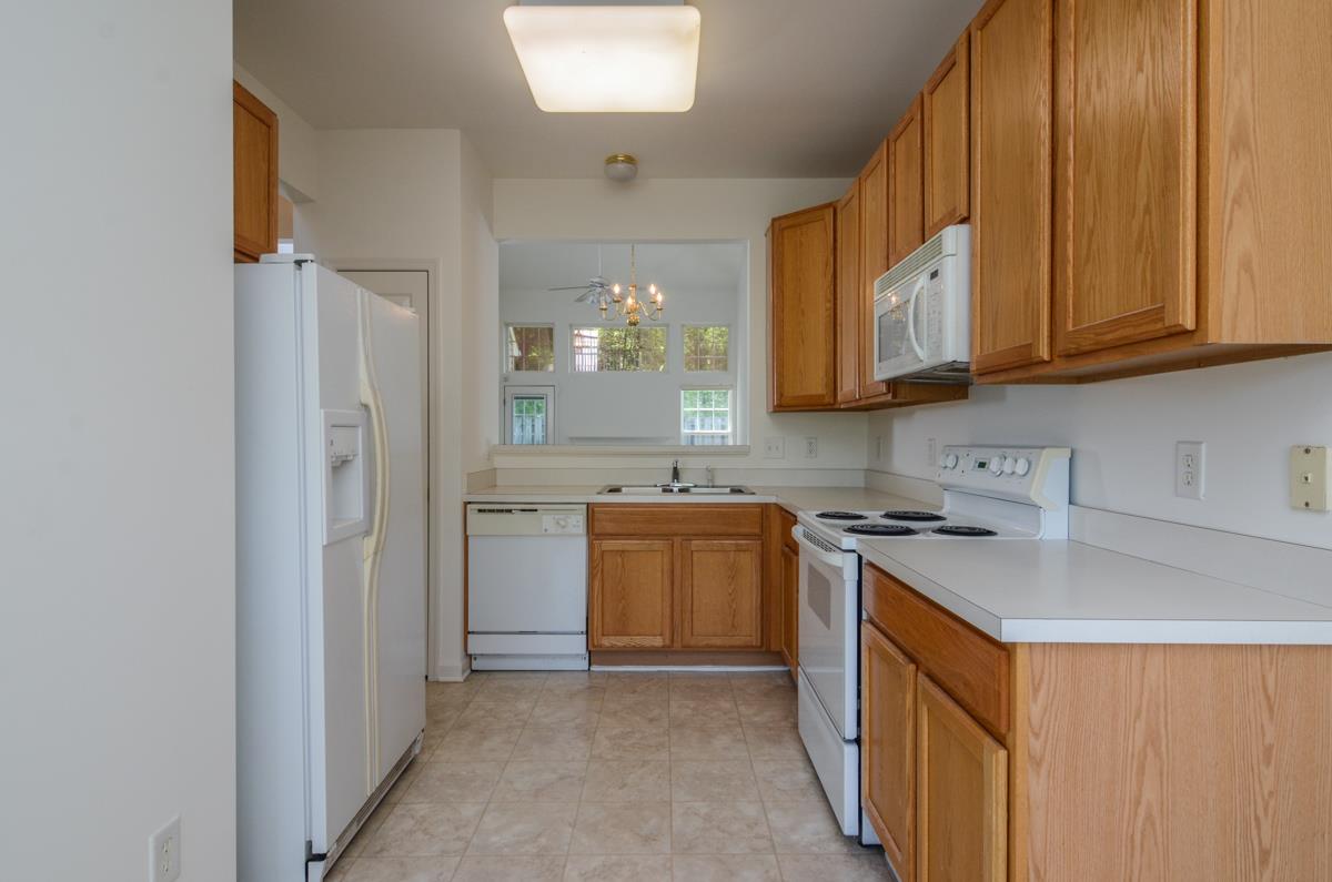 3401 Anderson Road, Unit 52 Antioch, TN 37013 - Photo 6 of 24 a kitchen with stainless steel appliances granite countertop a stove a sink and a refrigerator
