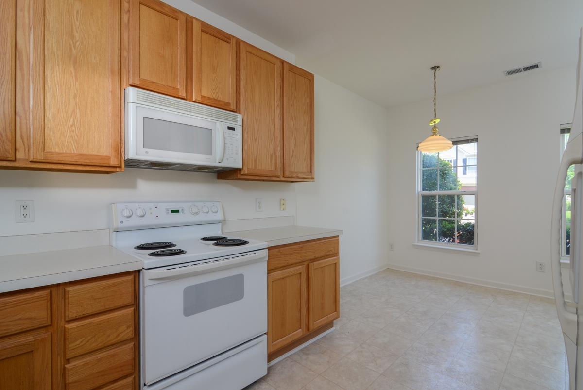 3401 Anderson Road, Unit 52 Antioch, TN 37013 - Photo 7 of 24 a kitchen with stainless steel appliances granite countertop white cabinets a stove top oven