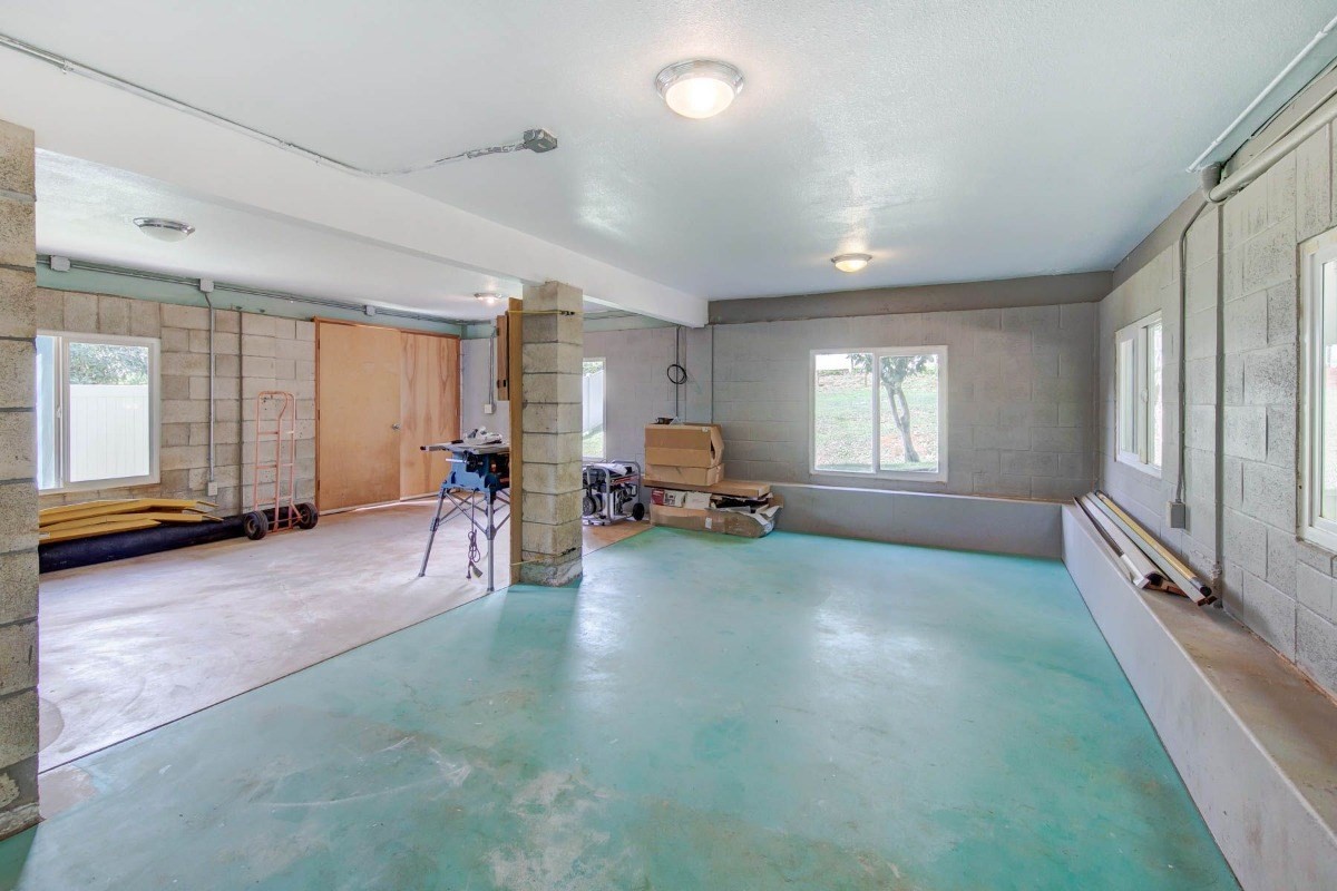 4875 Hauaala Road, Unit 1 Kapaa, HI 96746 - Photo 7 of 19 a living room with furniture and a large window