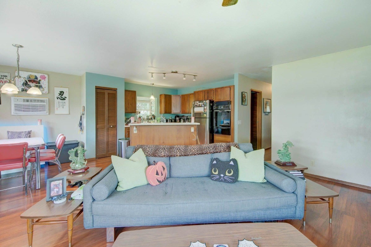 4875 Hauaala Road, Unit 1 Kapaa, HI 96746 - Photo 8 of 19 a living room with furniture and a chandelier