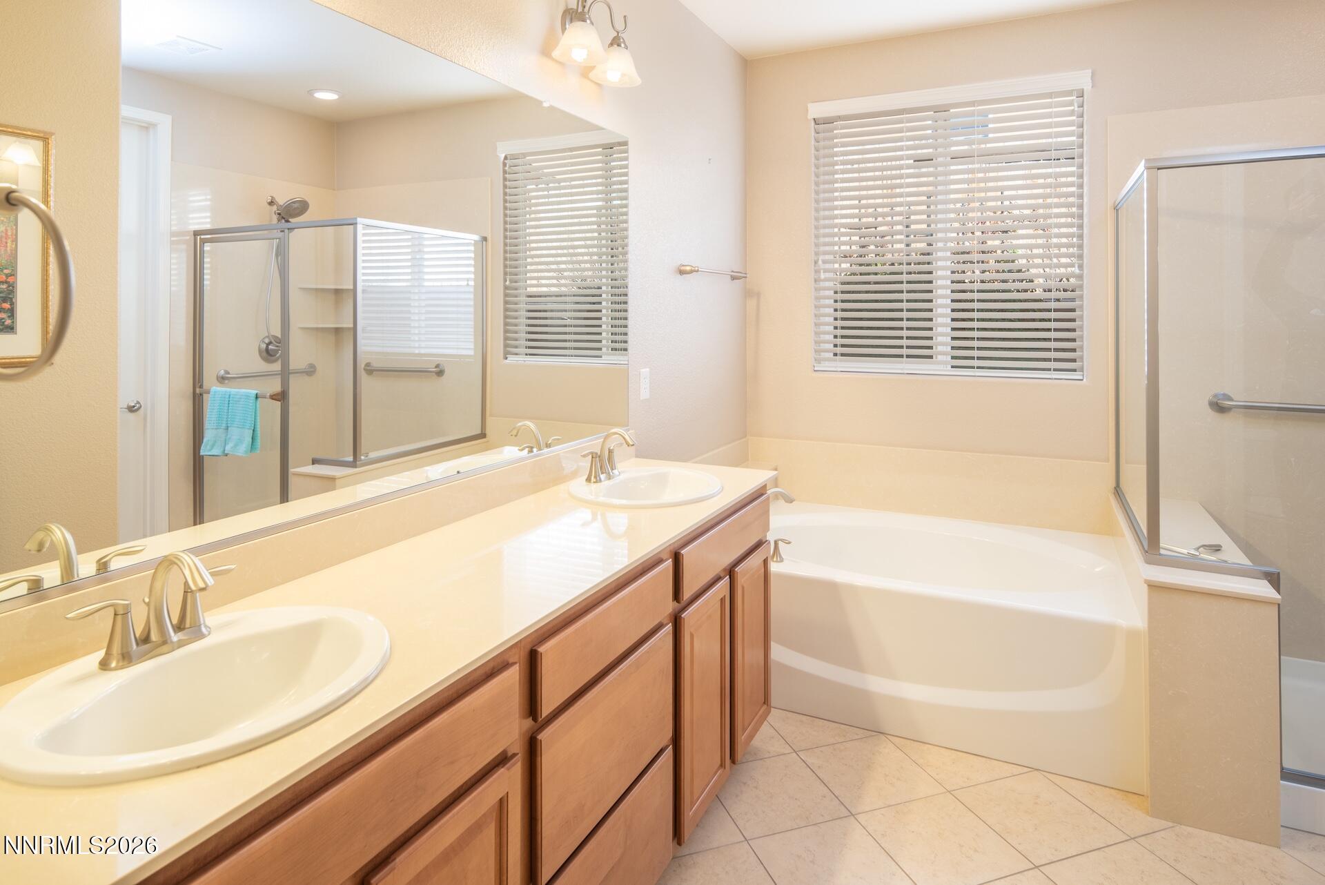 1413 Bluewood Drive Reno, NV 89523 - Photo 20 of 42 a bathroom with a tub sink and mirror