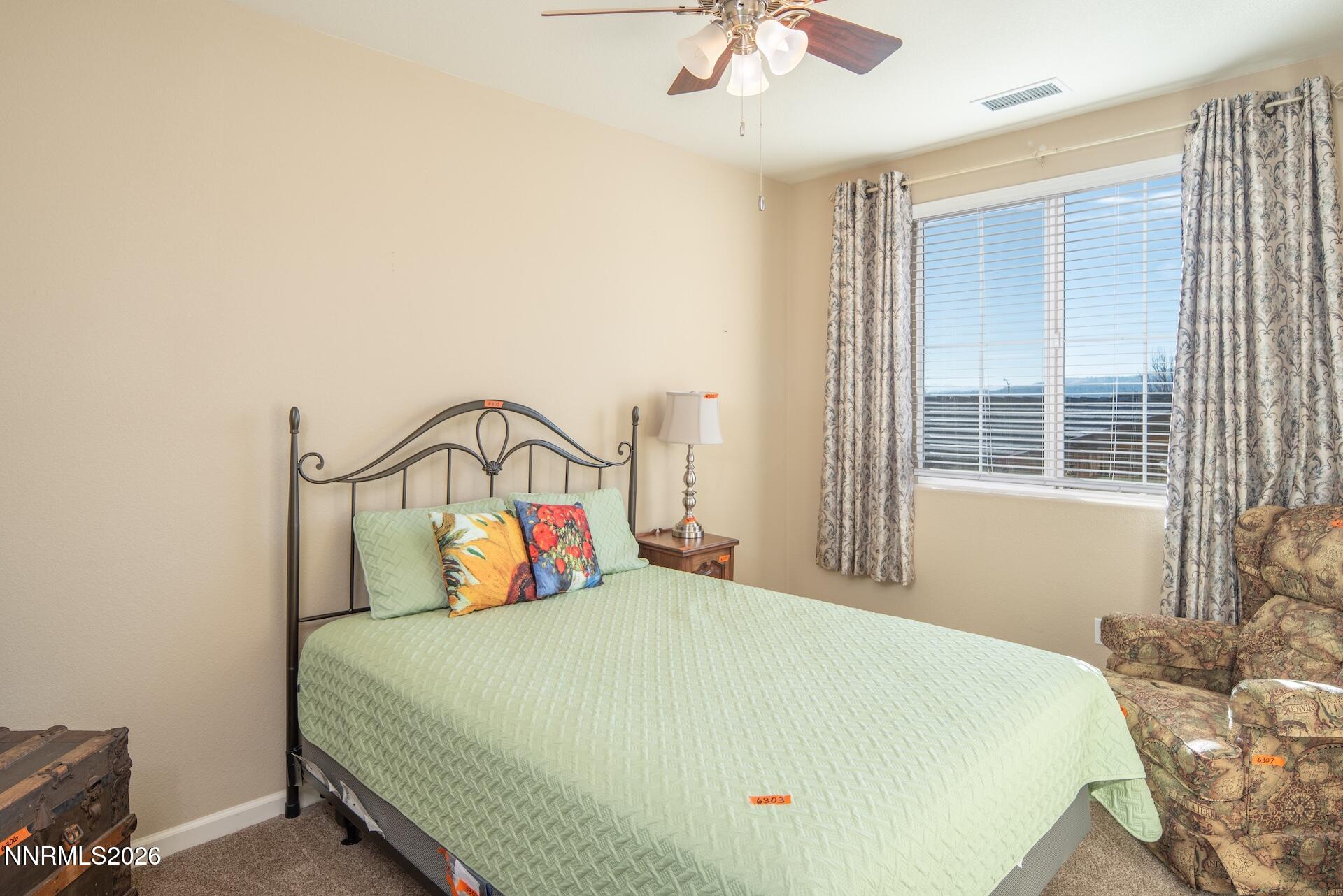 1413 Bluewood Drive Reno, NV 89523 - Photo 22 of 42 a bedroom with a bed and window