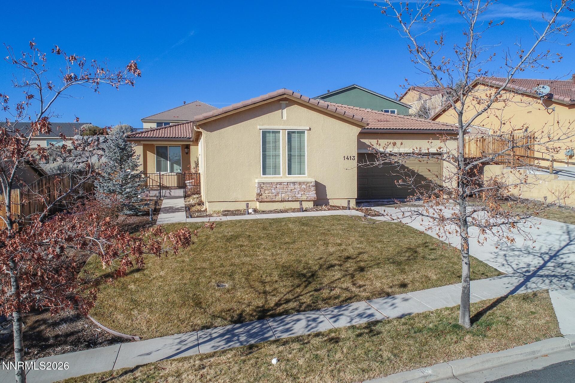 1413 Bluewood Drive Reno, NV 89523 - Photo 3 of 42 a view of a house with a yard