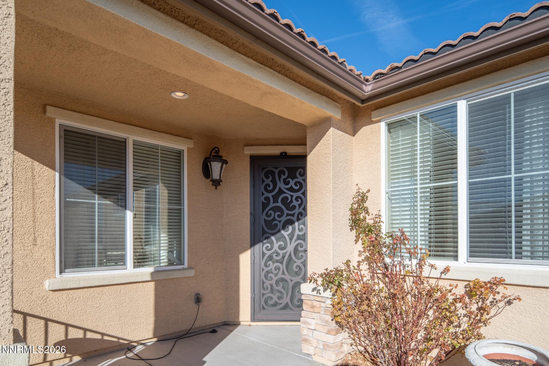 1413 Bluewood Drive Reno, NV 89523 - Photo 9 of 42 a front view of a house with a outdoor space