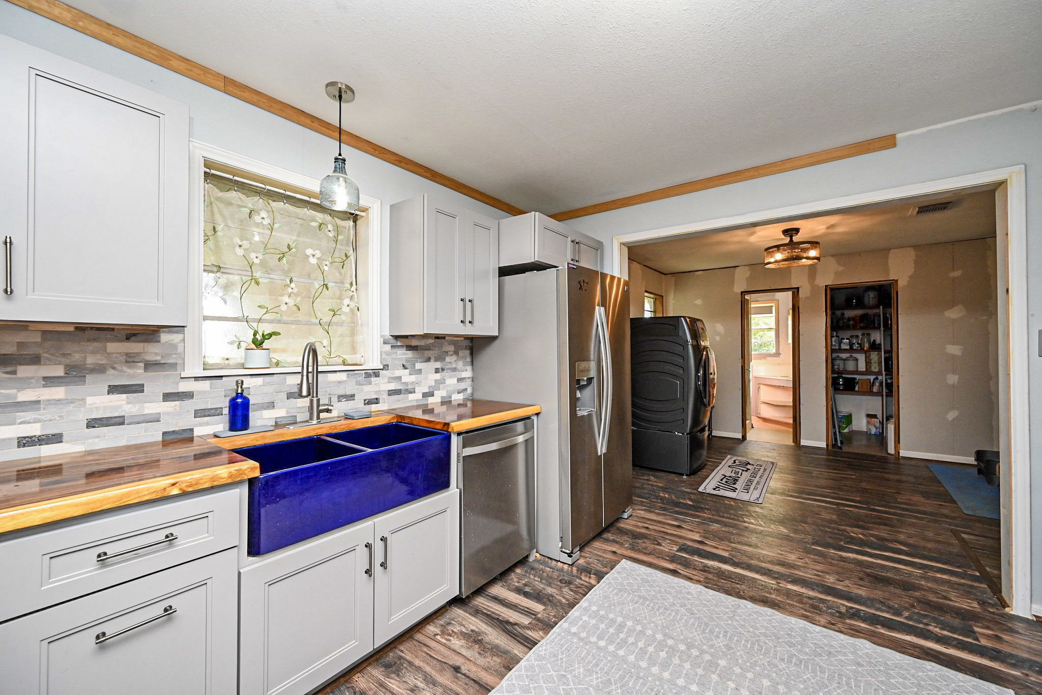 14920 Bj Dusek Road Wallis, TX 77485 - Photo 5 of 20 a kitchen with a refrigerator and a sink