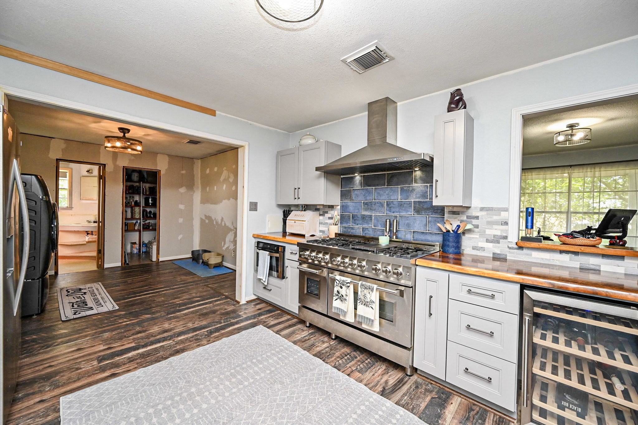 14920 Bj Dusek Road Wallis, TX 77485 - Photo 6 of 20 a kitchen with stainless steel appliances a stove and a refrigerator