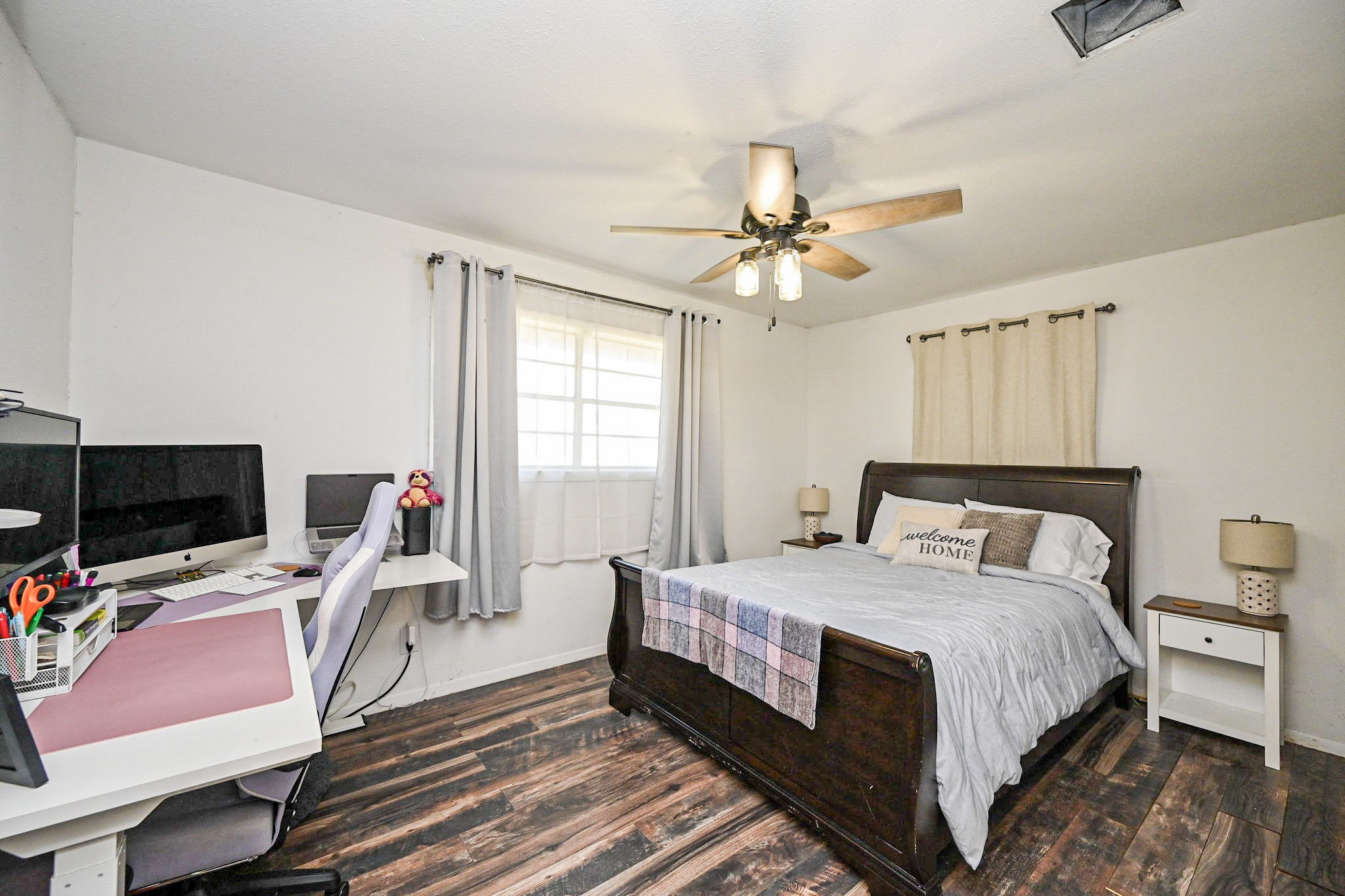 14920 Bj Dusek Road Wallis, TX 77485 - Photo 8 of 20 a bedroom with a bed table chair and a window