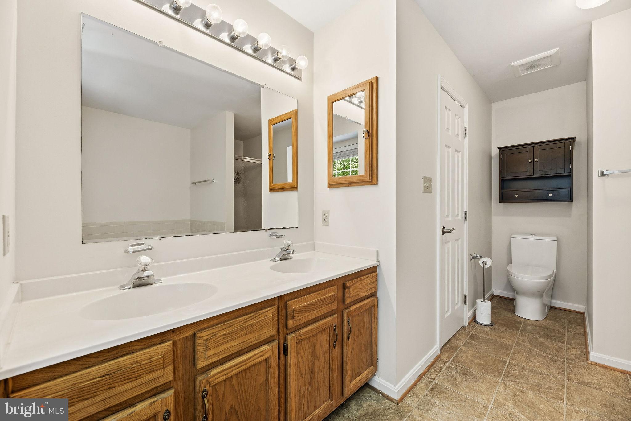 1040 Redeye Road Lusby, MD 20657 - Photo 25 of 51 Primary bath with double vanities