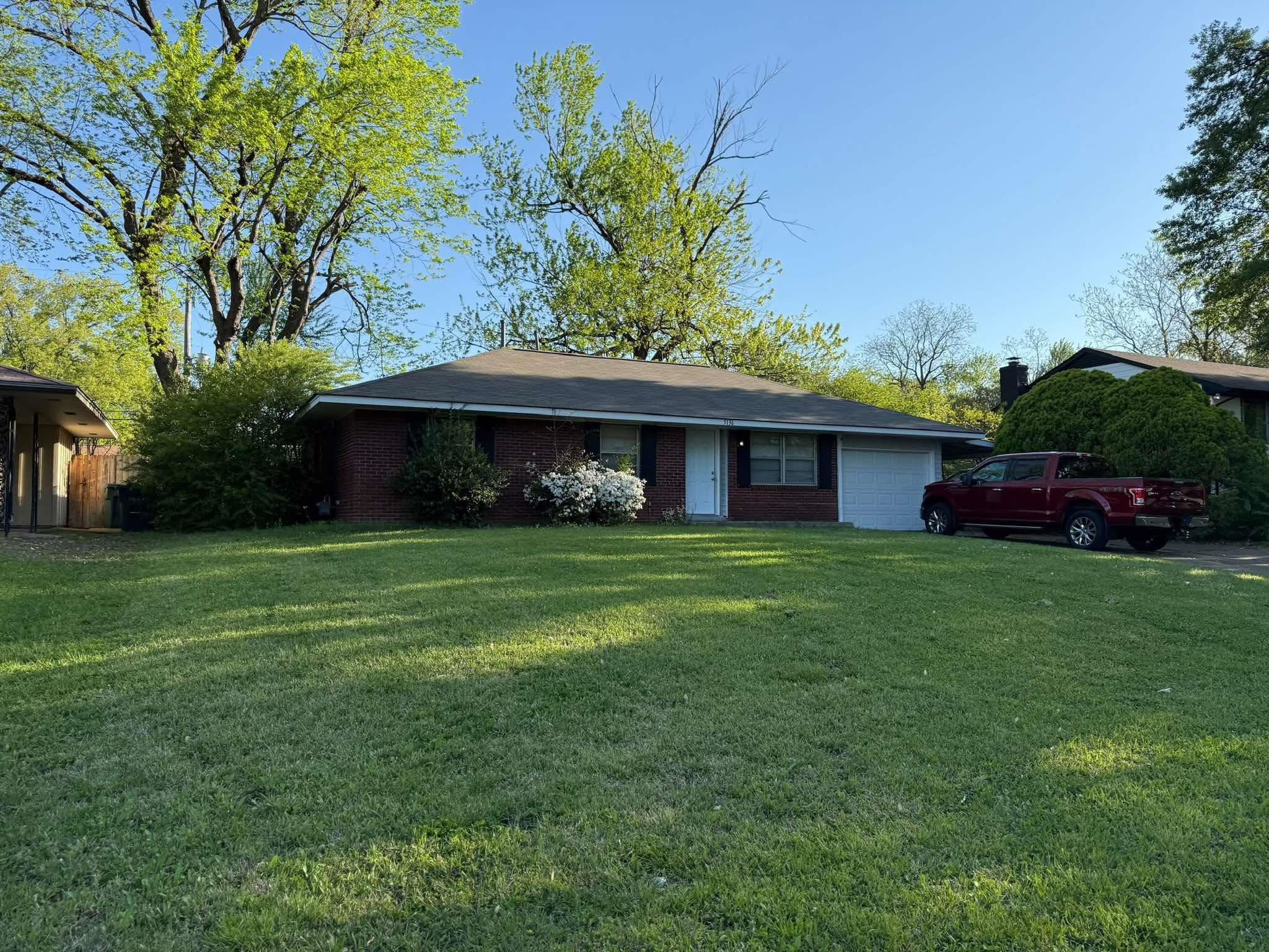 5136 Rolling Fields Drive Memphis, TN 38134 - Photo 2 of 2 a front view of a house with a garden