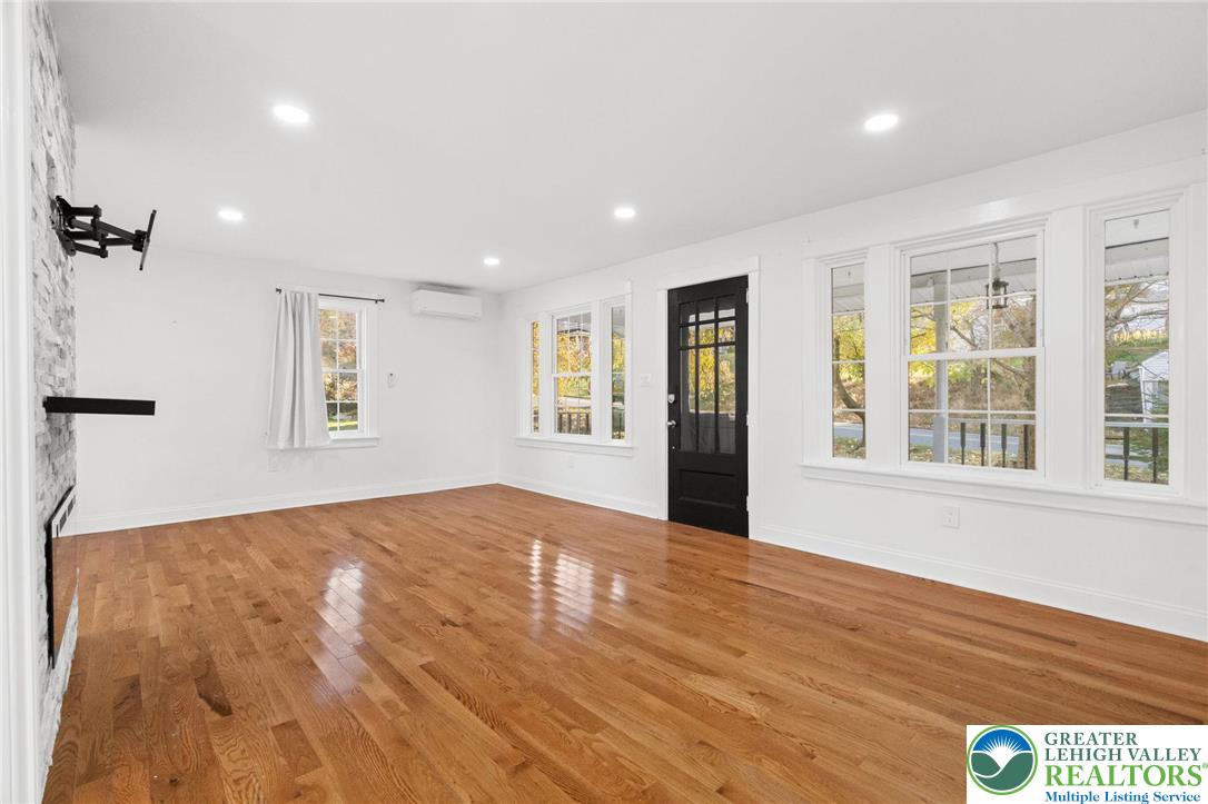 1439 Seidersville Road Bethlehem, PA 18015 - Photo 13 of 55 a view of an empty room with a window and wooden floor