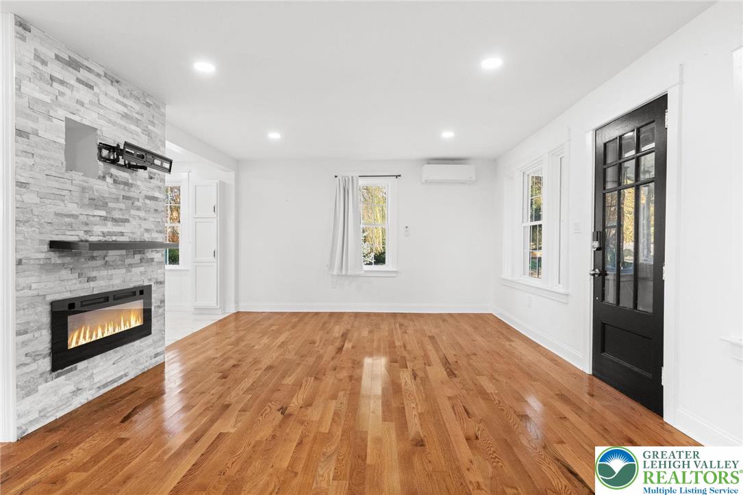 1439 Seidersville Road Bethlehem, PA 18015 - Photo 14 of 55 a view of an empty room with a fireplace and a window