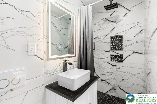 a view of a room with wooden floor and a window