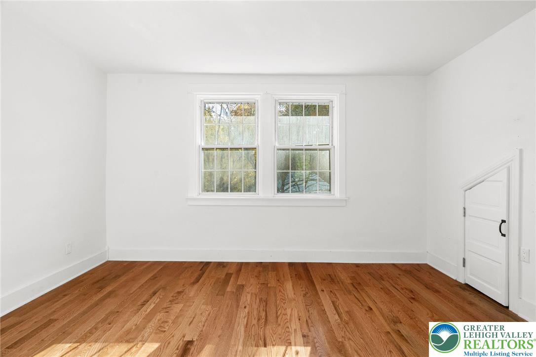 1439 Seidersville Road Bethlehem, PA 18015 - Photo 34 of 55 an empty room with wooden floor and windows