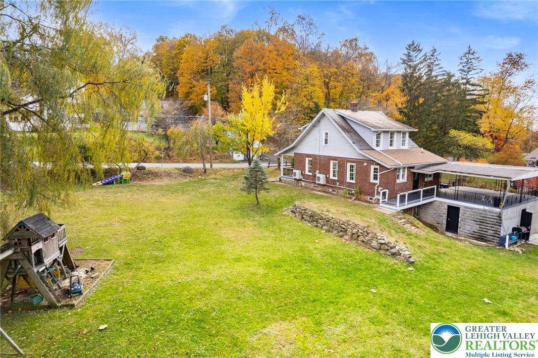 1439 Seidersville Road Bethlehem, PA 18015 - Photo 49 of 55 a aerial view of a house with swimming pool and large trees