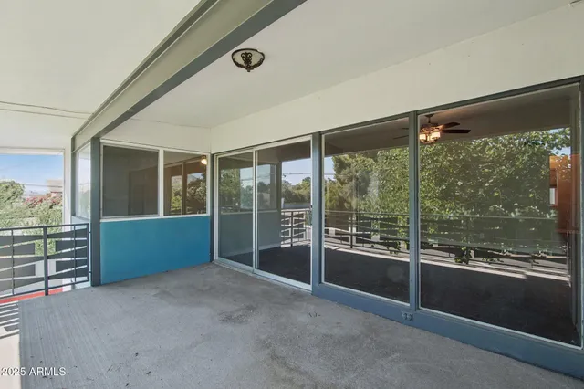 a view of an empty room with a large window