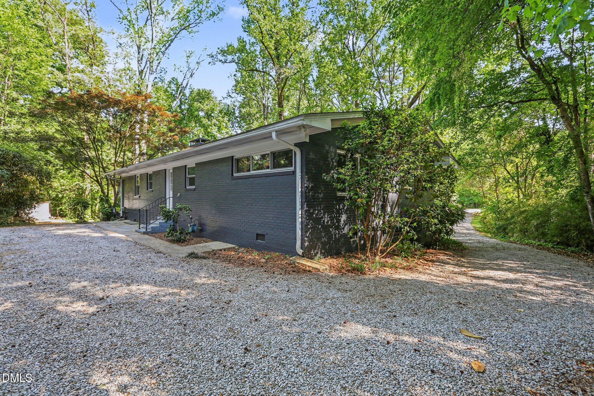 2600 Wade Avenue Raleigh, NC 27607 - Photo 24 of 31 a view of a house with large trees