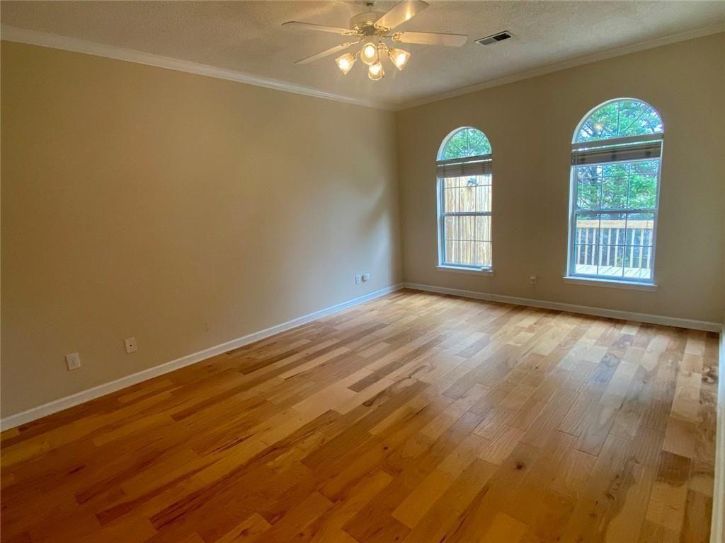 1698 Pin Oak Drive, Unit 129 Dalton, GA 30721 - Photo 17 of 37 a view of an empty room with window and wooden floor