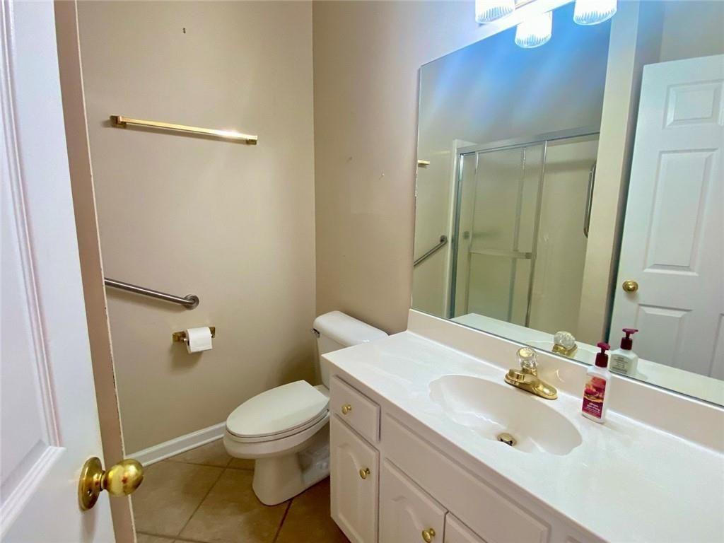 1698 Pin Oak Drive, Unit 129 Dalton, GA 30721 - Photo 26 of 37 a bathroom with a sink toilet and shower