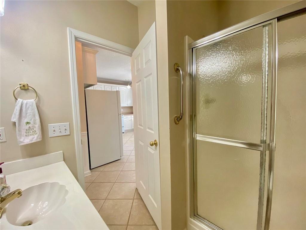 1698 Pin Oak Drive, Unit 129 Dalton, GA 30721 - Photo 28 of 37 a bathroom with a sink and a mirror