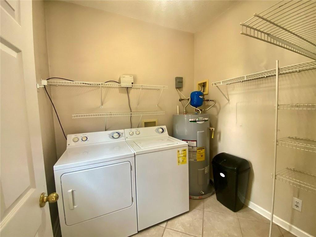 1698 Pin Oak Drive, Unit 129 Dalton, GA 30721 - Photo 29 of 37 a utility room with dryer and washer