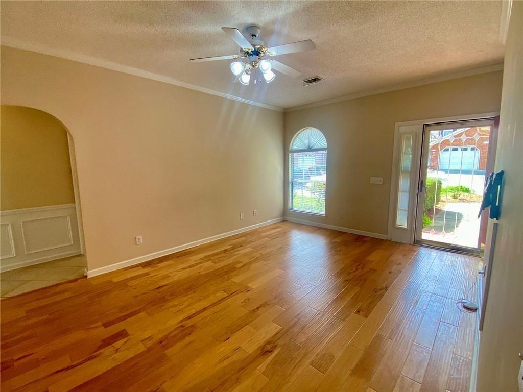 1698 Pin Oak Drive, Unit 129 Dalton, GA 30721 - Photo 6 of 37 a view of an empty room with window and wooden floor