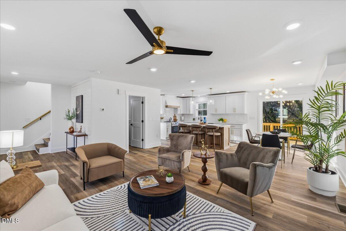 617 North 3rd Street Mebane, NC 27302 - Photo 15 of 50 a living room with furniture a rug and a ceiling fan