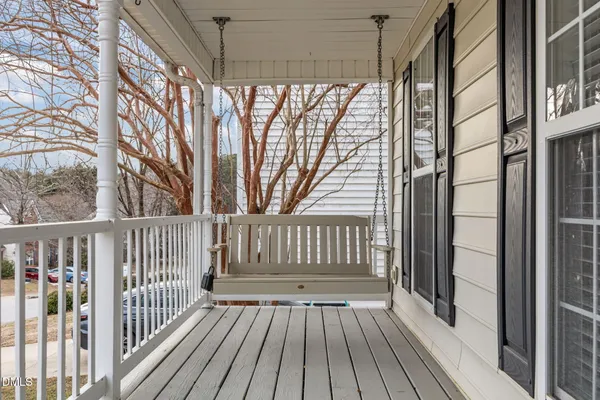 a view of porch with wooden floor