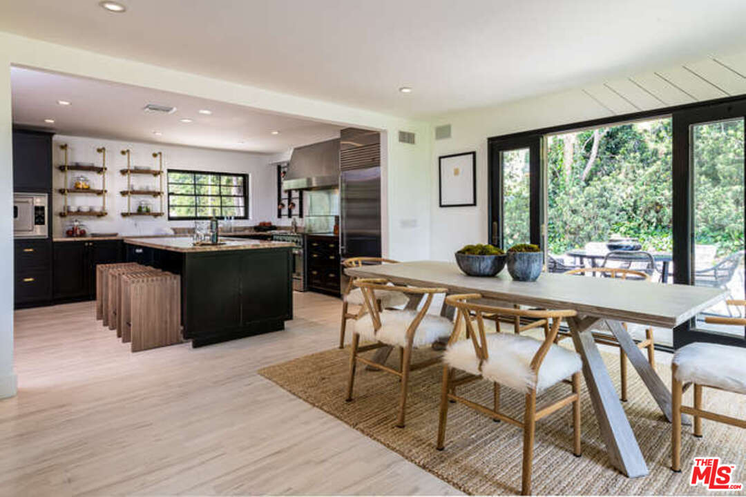 1374 Stradella Road Los Angeles, CA 90077 - Photo 11 of 47 a view of a dining room with furniture window and outside view