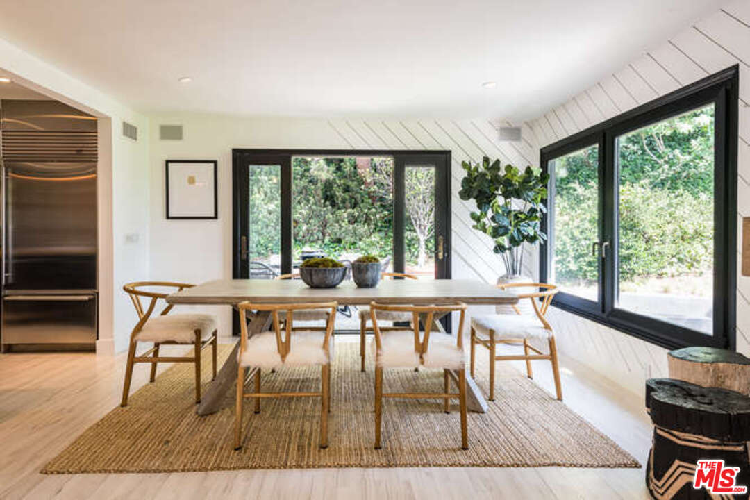 1374 Stradella Road Los Angeles, CA 90077 - Photo 12 of 47 a dining room with furniture window and wooden floor