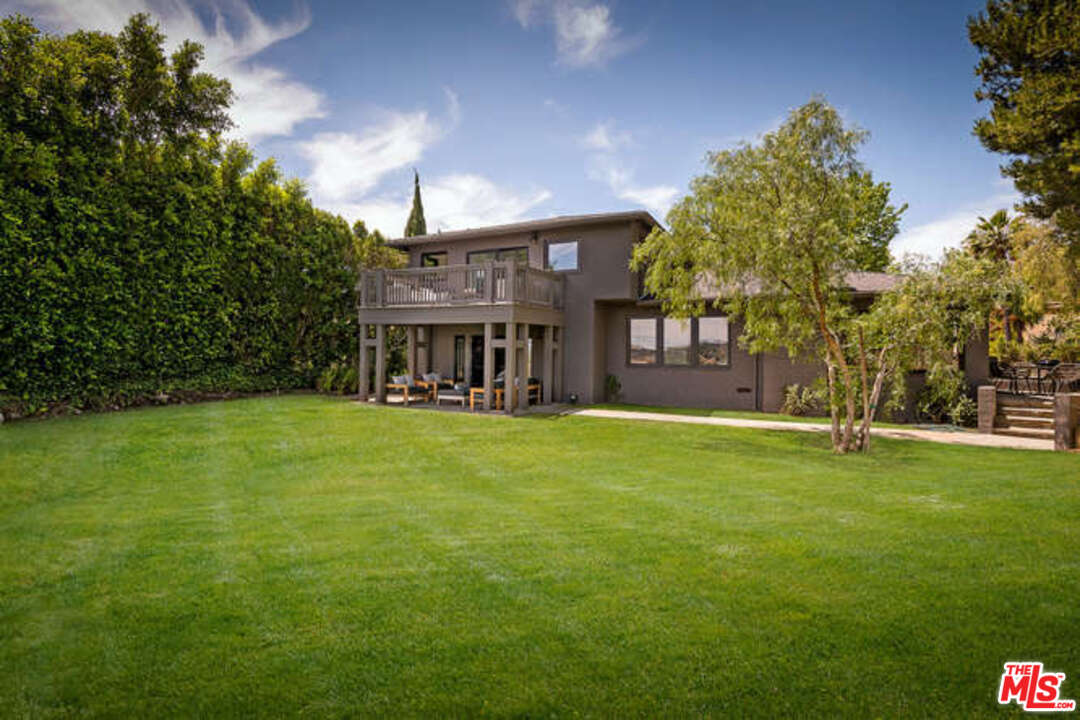 1374 Stradella Road Los Angeles, CA 90077 - Photo 4 of 47 a view of house with outdoor space and porch