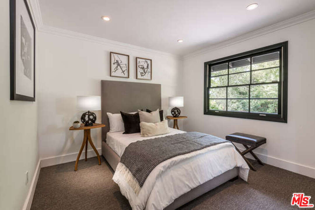 1374 Stradella Road Los Angeles, CA 90077 - Photo 34 of 47 a bedroom with bed and a window